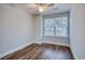 Bright bedroom featuring wood-look flooring, a ceiling fan, and natural light from a window at 2705 Mercer Dr. # 2705, Conway, SC 29526