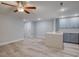 This eat-in kitchen features stainless steel appliances, light blue cabinets, quartz countertops, and a ceiling fan at 2705 Mercer Dr. # 2705, Conway, SC 29526