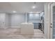 A light and airy kitchen featuring stainless steel appliances, light blue cabinets and quartz countertops at 2705 Mercer Dr. # 2705, Conway, SC 29526