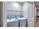 Convenient laundry room with washer, dryer, wire shelving, and natural light at 2705 Mercer Dr. # 2705, Conway, SC 29526