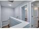 Top of staircase with white railing and view of bedroom with hardwood floors and ceiling fan at 2705 Mercer Dr. # 2705, Conway, SC 29526