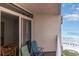 Relaxing balcony featuring outdoor seating and partial view of the beach at 2710 S Ocean Blvd. # 1010, North Myrtle Beach, SC 29582
