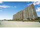 Exterior view of a beachfront condo community overlooking the ocean at 2710 S Ocean Blvd. # 1010, North Myrtle Beach, SC 29582
