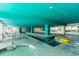 Indoor pool with beautiful tiling and lounge chairs, an ideal space for relaxation and recreation at 2710 S Ocean Blvd. # 1010, North Myrtle Beach, SC 29582