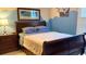 Comfortable bedroom with a tropical-themed decor and a dark wood sleigh bed at 337 Sailors Ct., Myrtle Beach, SC 29577