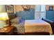 Comfortable bedroom featuring a decorative headboard, matching bedside table, and bright natural light at 337 Sailors Ct., Myrtle Beach, SC 29577