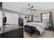 Spacious main bedroom with ceiling fan, closet, and natural light from dual windows at 403 Sean River Rd., Conway, SC 29526