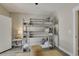 This is a bedroom with a three-tiered bunk bed, and a small table next to the door at 417 Seabreeze Dr., Garden City Beach, SC 29576