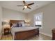 This is a bedroom with a bed and a ceiling fan and two night stands with lamps at 417 Seabreeze Dr., Garden City Beach, SC 29576