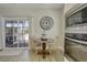 Charming breakfast nook adjacent to the kitchen, complete with a table and chairs at 417 Seabreeze Dr., Garden City Beach, SC 29576