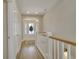 Bright entryway featuring wood floors, white trim, and a decorative wreath on the front door at 417 Seabreeze Dr., Garden City Beach, SC 29576