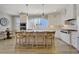 Bright and spacious kitchen with a large island, modern appliances, and plenty of counter space at 417 Seabreeze Dr., Garden City Beach, SC 29576