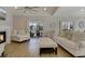 Bright living room featuring fireplace, a ceiling fan, wood flooring, and comfortable seating with an outside view at 417 Seabreeze Dr., Garden City Beach, SC 29576