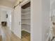 Pantry featuring a sliding barn door and custom shelving at 417 Seabreeze Dr., Garden City Beach, SC 29576