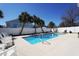 Inviting pool area surrounded by palm trees and lounge chairs, perfect for relaxation and enjoyment at 417 Seabreeze Dr., Garden City Beach, SC 29576