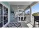Inviting screened porch with a screen door and a view of the neighborhood at 417 Seabreeze Dr., Garden City Beach, SC 29576