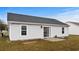 Back of home with sliding glass door and small patio at 4355 Heartwood Ln., Myrtle Beach, SC 29579