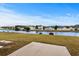 Water view backyard with patio, lush green grass and mature trees at 4355 Heartwood Ln., Myrtle Beach, SC 29579