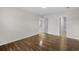 Bedroom featuring wood-look floors, a closet, and bathroom access at 4355 Heartwood Ln., Myrtle Beach, SC 29579