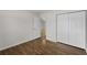 Bedroom view of closet and doorway with wood-look floors at 4355 Heartwood Ln., Myrtle Beach, SC 29579
