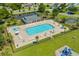 Aerial view of the community pool with ample seating, playground and basketball court at 4355 Heartwood Ln., Myrtle Beach, SC 29579