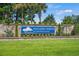 Entrance sign for Walkers Woods at Carolina Forest set in a stone wall with manicured landscaping at 4355 Heartwood Ln., Myrtle Beach, SC 29579