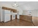Spacious kitchen with breakfast bar and white appliances flows into an adjoining living area at 4355 Heartwood Ln., Myrtle Beach, SC 29579