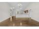 Spacious living room boasting wood floors and an open layout leading into the modern kitchen at 4355 Heartwood Ln., Myrtle Beach, SC 29579