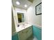 Bathroom features a white vanity, a decorative mirror, and recessed lighting for a bright space at 4430 Eastport Blvd. # L9, Little River, SC 29566