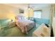 Comfortable bedroom featuring a ceiling fan, two side tables, and a floral-patterned bedspread at 4430 Eastport Blvd. # L9, Little River, SC 29566