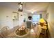 Cozy dining area with stylish light fixture and a view into the comfortable living room at 4430 Eastport Blvd. # L9, Little River, SC 29566