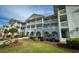 Charming condominium complex with well-maintained landscaping and multiple balconies at 4430 Eastport Blvd. # L9, Little River, SC 29566