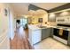 Bright kitchen featuring modern appliances and an open layout connecting to the living area at 4430 Eastport Blvd. # L9, Little River, SC 29566