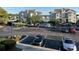 A parking lot outside of an apartment building near the water features many parked cars and landscaping at 4430 Eastport Blvd. # L9, Little River, SC 29566