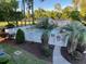 A secluded community pool surrounded by lush vegetation and a white picket fence in a park setting at 4430 Eastport Blvd. # L9, Little River, SC 29566