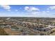 Beautiful aerial view showcasing the community's waterfront location and waterway access with city skyline in the distance at 4520 N Plantation Harbour Dr. # F9, Little River, SC 29566