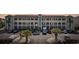 View of condo building exterior with well-maintained landscaping and convenient parking at 4520 N Plantation Harbour Dr. # F9, Little River, SC 29566