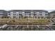 Exterior view of the home featuring a small pier and waterfront access at 4520 N Plantation Harbour Dr. # F9, Little River, SC 29566