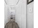 Hallway with multiple storage closets leading to a bathroom with a shower and tub at 4520 N Plantation Harbour Dr. # F9, Little River, SC 29566