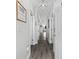 Bright hallway featuring light gray walls, multiple white doors, and modern lighting fixtures at 4520 N Plantation Harbour Dr. # F9, Little River, SC 29566