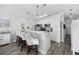 Modern kitchen with white cabinets, stainless steel appliances, a breakfast bar and stylish pendant lighting at 4520 N Plantation Harbour Dr. # F9, Little River, SC 29566