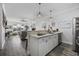 Kitchen featuring white countertops, stainless steel appliances, and views into the living room at 4520 N Plantation Harbour Dr. # F9, Little River, SC 29566