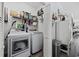 This organized laundry room features white appliances and wire shelving at 4520 N Plantation Harbour Dr. # F9, Little River, SC 29566