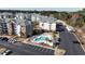 Community aerial showcasing the pool and surrounding apartment buildings with easy parking at 4865 Luster Leaf Circle # 402, Myrtle Beach, SC 29577