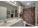 Bathroom featuring double sink vanity and decorative shower curtain at 4865 Luster Leaf Circle # 402, Myrtle Beach, SC 29577