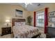 Comfortable bedroom featuring a queen size bed with tasteful furnishings, natural light and decorative artwork at 4865 Luster Leaf Circle # 402, Myrtle Beach, SC 29577