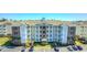 Beautiful condo building with stone accents and well maintained landscaping in a community with ample parking at 4865 Luster Leaf Circle # 402, Myrtle Beach, SC 29577