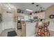 Open concept kitchen with stainless appliances, granite counters, and a breakfast bar perfect for entertaining at 4865 Luster Leaf Circle # 402, Myrtle Beach, SC 29577