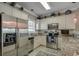 Well lit kitchen featuring stainless steel appliances, granite countertops, and lots of cabinet space at 4865 Luster Leaf Circle # 402, Myrtle Beach, SC 29577