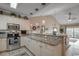 Open kitchen with granite countertops, stainless appliances, breakfast bar with views into the living area at 4865 Luster Leaf Circle # 402, Myrtle Beach, SC 29577